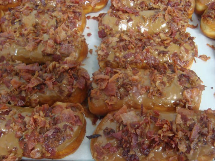 <b>Louisiana: Maple Iced Longjohn Donut with Bacon</b> Maple-glazed donuts are taken to the next level with crispy bits of bacon from Blue Dot Donuts.<br> <br> (Image courtesy Blue Dot Donuts)