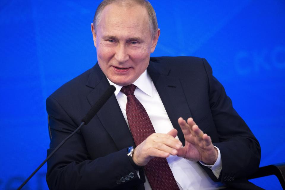 Russian President Vladimir Putin gestures while speaking at a meeting of the Russian Union of Industrialists and Entrepreneurs in Moscow, Russia, Thursday, March 14, 2019. Putin urged the business community to engage more actively in major infrastructure projects and vowed to create more incentives and help reduce investment risks. (AP Photo/Alexander Zemlianichenko)