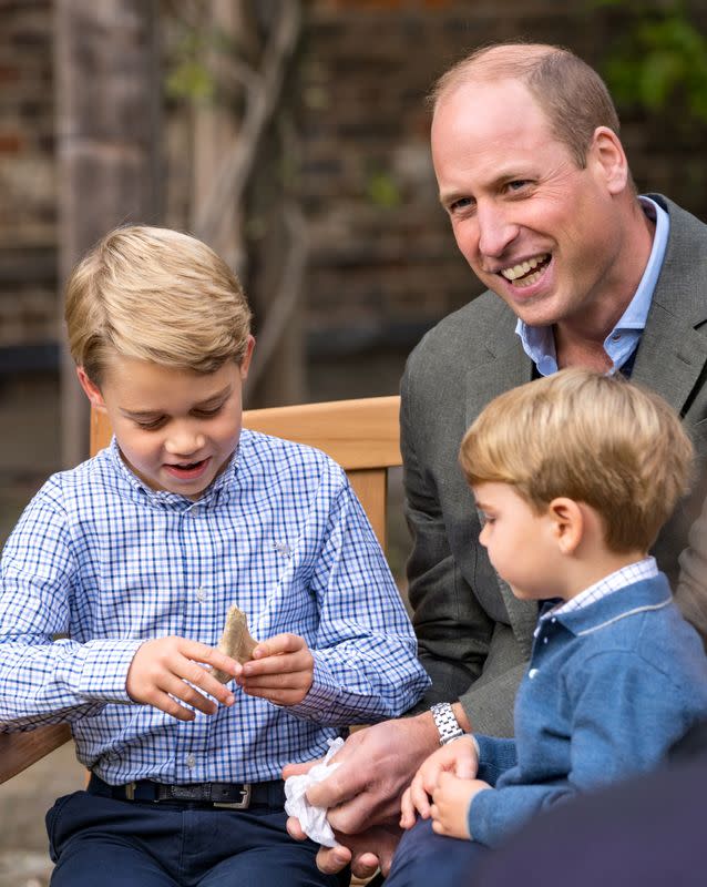 A handout photo released by Britain's Prince William and Cathrine, Duchess of Cambridge, Prince George, Princess Charlotte and Prince Louis with David Attenborough, in London