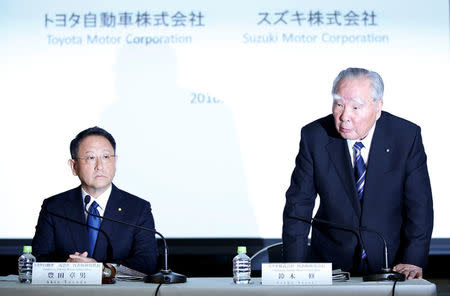 Toyota Motor Corp President Akio Toyoda (L) and Suzuki Motor Chairman and CEO Osamu Suzuki attend their joint news conference in Tokyo, Japan, October 12, 2016. REUTERS/Toru Hanai