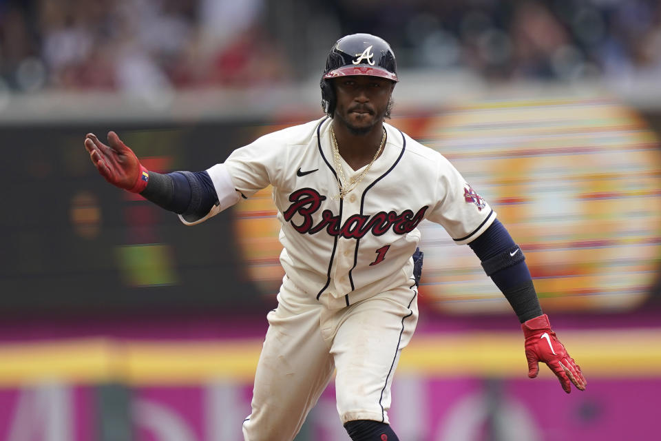 Atlanta Braves second baseman Ozzie Albies (1) reacts after hitting an RBI double in the third inning of a baseball game against the Los Angeles Dodgers Sunday, June 6, 2021, in Atlanta. (AP Photo/Brynn Anderson)