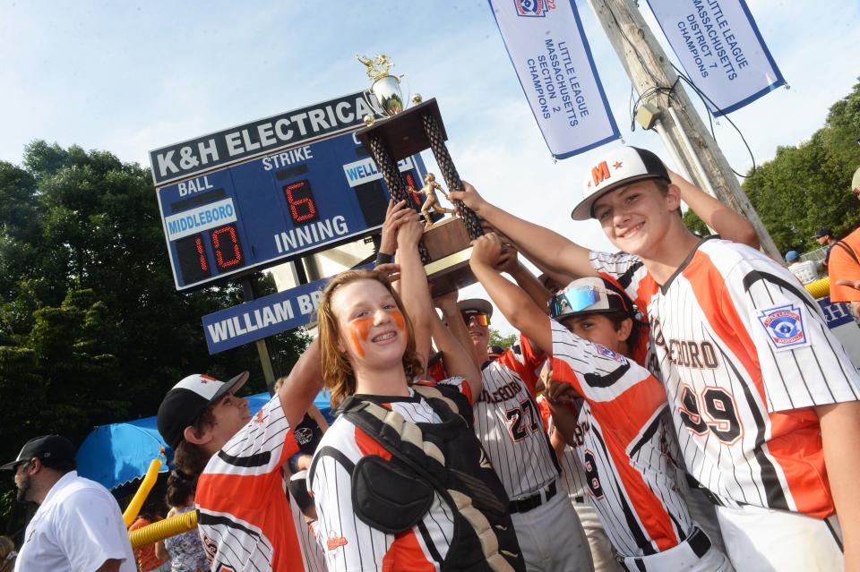 Middleboro 12U Nationals players hoist the state title trophy at Dunn Little League Complex at Hollingsworth Park in Braintree on Sunday, July 31, 2022.