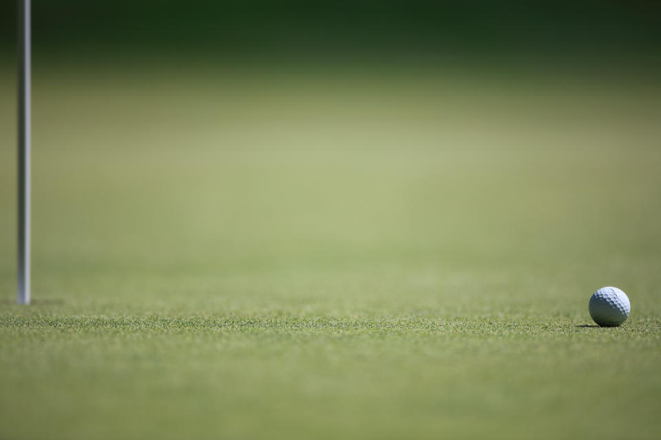 A generic image of a golf ball near the pin