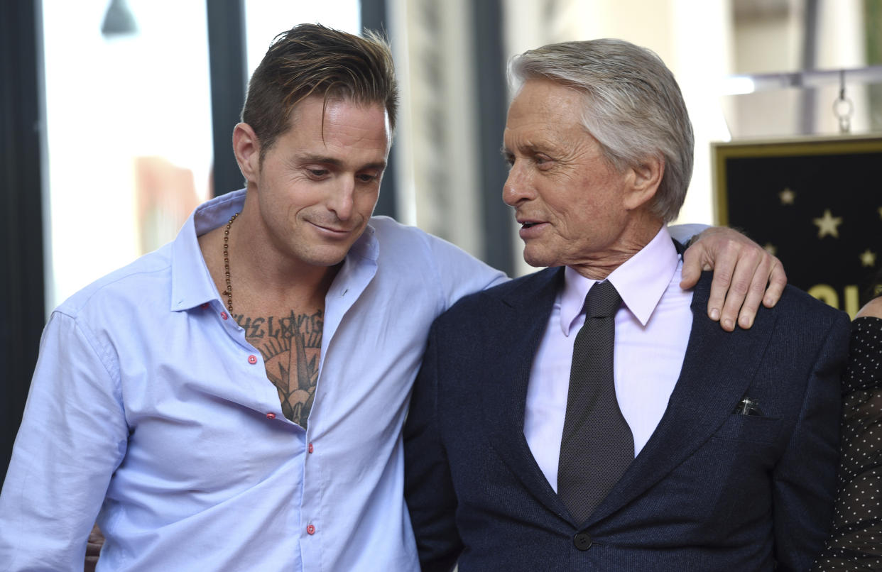 Honoree and actor Michael Douglas, right, poses with his son actor Cameron Douglas following a ceremony honoring him with a star on the Hollywood Walk of Fame on Tuesday, Nov. 6, 2018, in Los Angeles. (Photo by Chris Pizzello/Invision/AP)