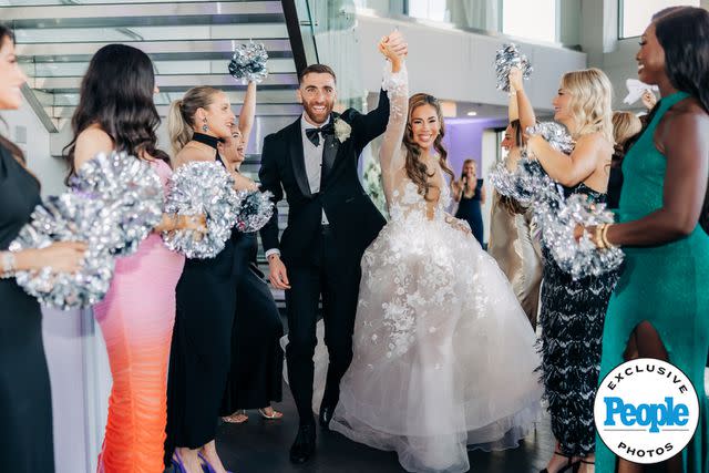 <p>Ella Farrell Photography </p> Matt and Ashley Turner arrive at their wedding reception