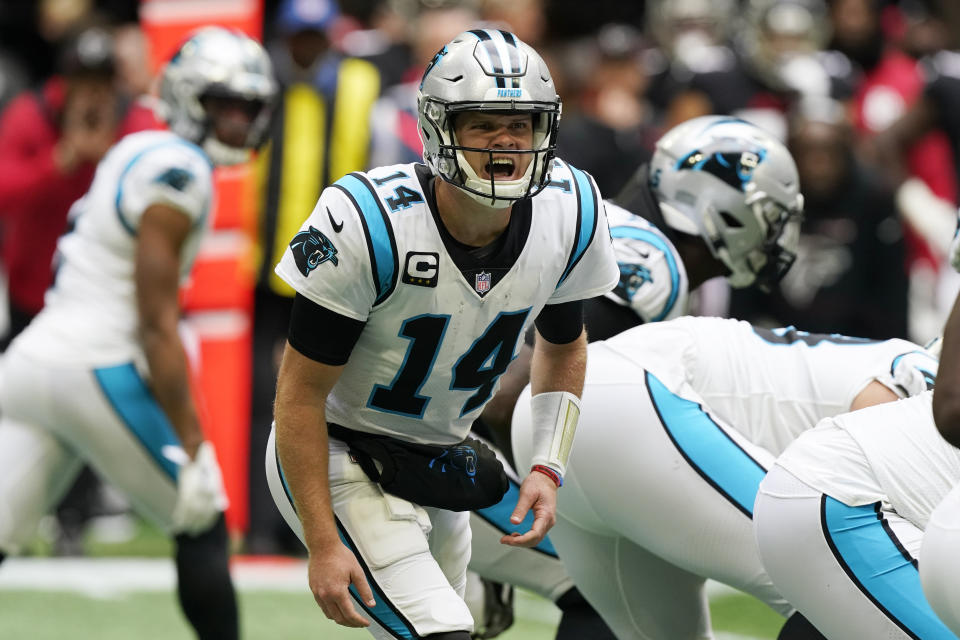 Carolina Panthers quarterback Sam Darnold (14) speaks during the first half of an NFL football game against the Atlanta Falcons , Sunday, Oct. 31, 2021, in Atlanta. (AP Photo/Mark Humphrey)