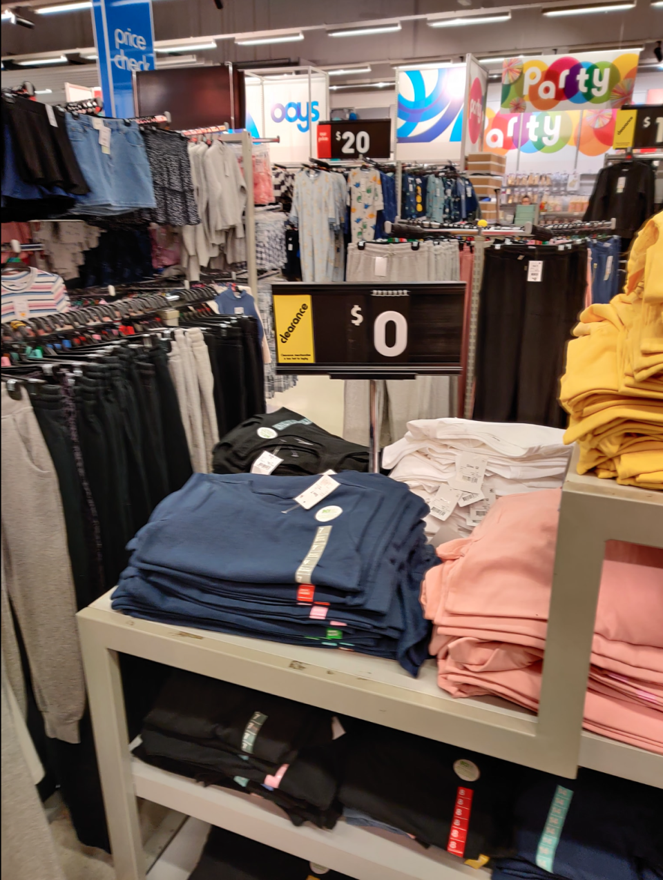 Clothes on display in a Kmart store featuring a $0 price sign