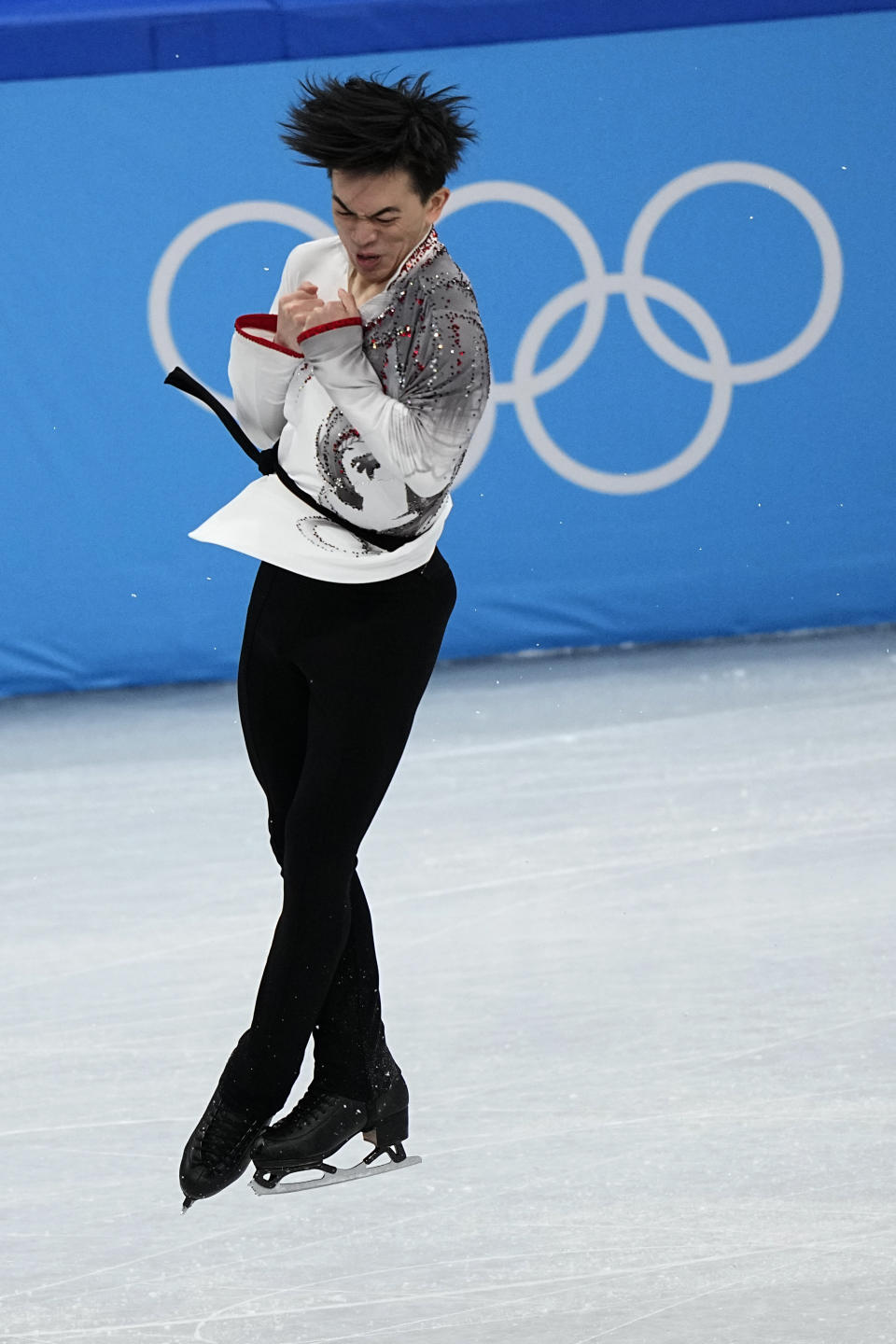 Vincent Zhou, of the United States, competes in the men's team free skate program during the figure skating competition at the 2022 Winter Olympics, Sunday, Feb. 6, 2022, in Beijing. (AP Photo/David J. Phillip)