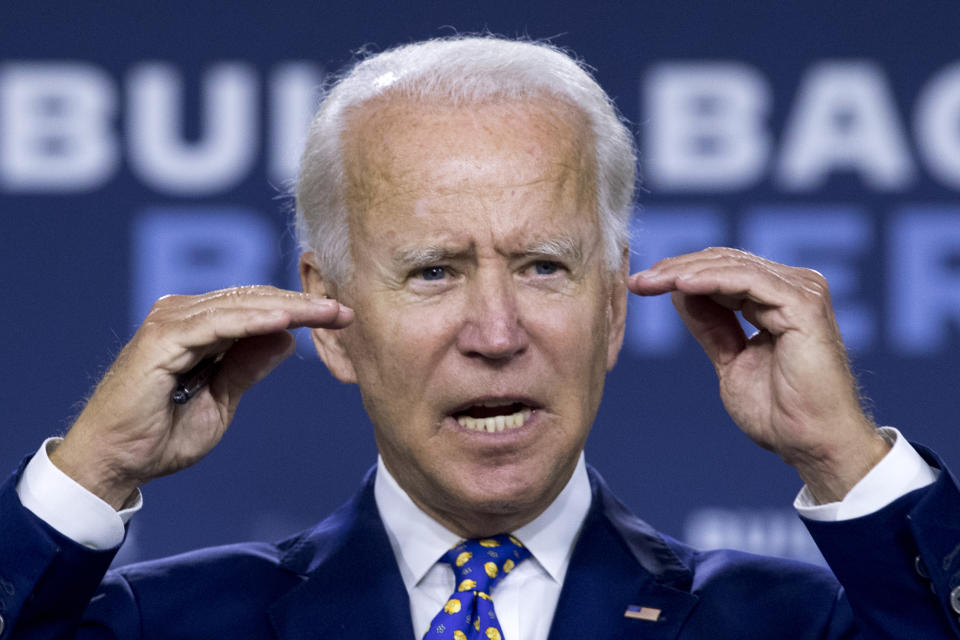 FILE - In this July 28, 2020 file photo, Democratic presidential candidate former Vice President Joe Biden speaks at a campaign event at the William "Hicks" Anderson Community Center in Wilmington, Del. Biden will not travel to Milwaukee to accept his party's White House nomination because of concerns over the coronavirus. Party officials confirmed the change in plans on Wednesday. (AP Photo/Andrew Harnik)