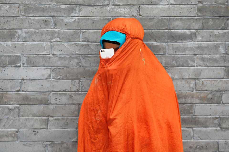 <p>A woman uses her mobile phone under a veil on the Eid al-Adha at the historic Niujie mosque in Beijing, China, Sept. 1, 2017. (Photo: Damir Sagolj/Reuters) </p>