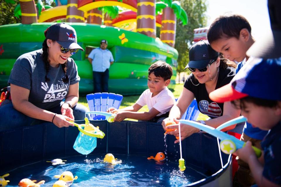 Kids play at the Family Fun Zone during Fourth of July festivities at Barney Schwartz Park in Paso Robles on July 4, 2023.