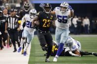 Washington Commanders running back J.D. McKissic (23) carries the ball for a long gain as Dallas Cowboys linebacker Leighton Vander Esch (55) moves in to make the stop in the first half of a NFL football game in Arlington, Texas, Sunday, Oct. 2, 2022. (AP Photo/Michael Ainsworth)