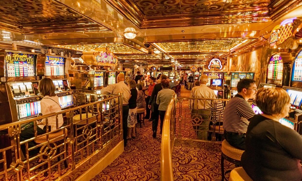 <span>Casinos with gaming tables and poker machines are common on large, mainstream cruise ships and some smaller luxury cruises.</span><span>Photograph: John Greim/LightRocket/Getty Images</span>
