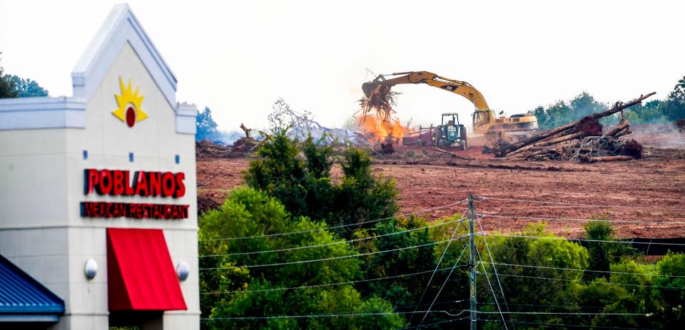 Land is cleared Wednesday near Walmart on Cobbs Ford Road in Prattville for a new residential development.