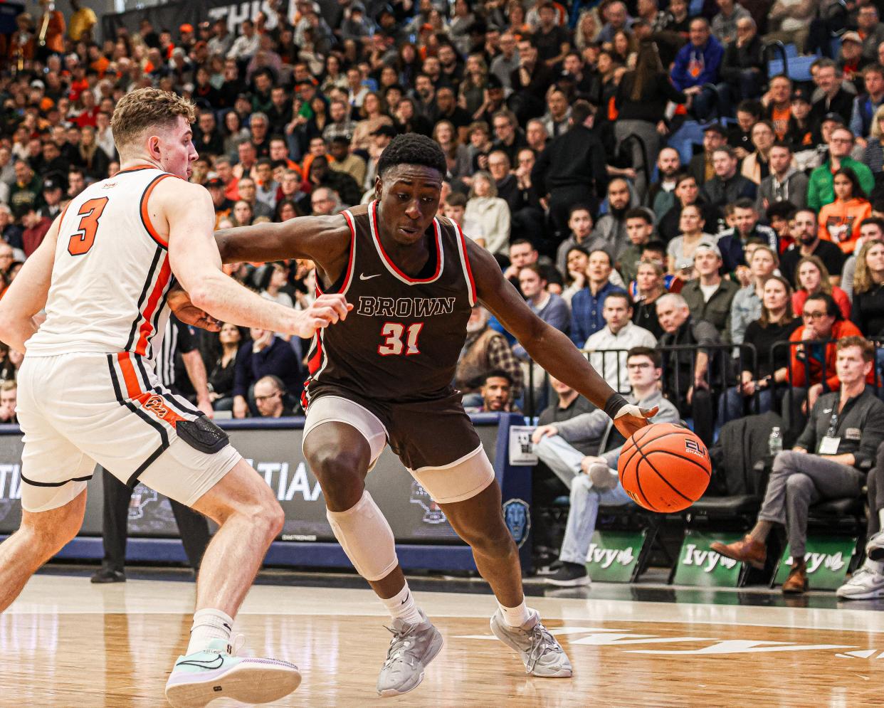 Brown's Nana Owusu-Anane pushes the ball against a Princeton defender in the Ivy League semifinals Saturday morning in New York.