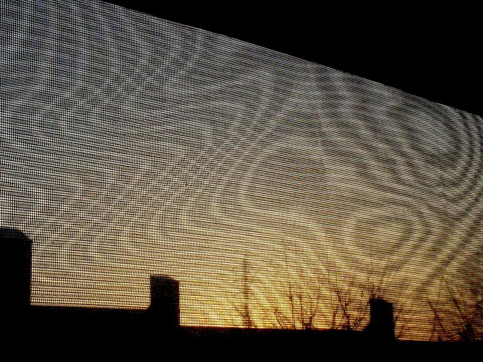 <span class="caption">Moiré patterns that change as the wind outside varies can be produced by an insect screen and a net curtain.</span> <span class="attribution"><span class="source">Kevin Nute</span>, <a class="link " href="http://creativecommons.org/licenses/by/4.0/" rel="nofollow noopener" target="_blank" data-ylk="slk:CC BY;elm:context_link;itc:0;sec:content-canvas">CC BY</a></span>