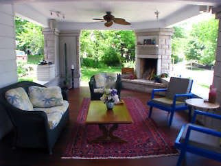 The porch is essentially an outdoor living room, with fireplace. Photo by Carrol Krause