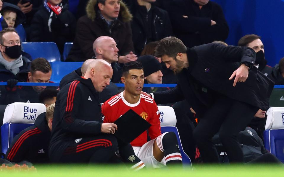 Manchester United's Cristiano Ronaldo with interim manager Michael Carrick as he gets ready to come on as a substitute - Reuters