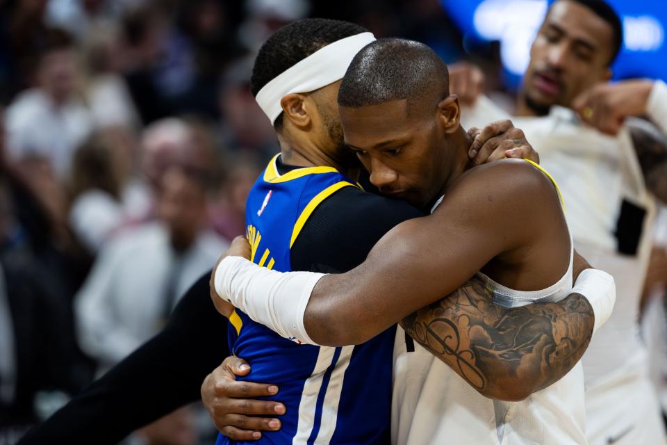 Utah Jazz guard Kris Dunn (11) hugs Golden State Warriors guard <a class="link " href="https://sports.yahoo.com/nba/players/5739/" data-i13n="sec:content-canvas;subsec:anchor_text;elm:context_link" data-ylk="slk:Gary Payton II;sec:content-canvas;subsec:anchor_text;elm:context_link;itc:0">Gary Payton II</a> (0) after the Jazz’s 140-137 loss in the NBA basketball against the Golden State Warriors at the Delta Center in Salt Lake City on Thursday, Feb. 15, 2024. | Megan Nielsen, Deseret News