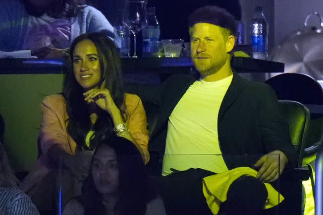 AP Photo/Jae C. Hong Prince Harry and Meghan Markle watch the L.A. Lakers