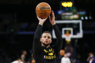 Golden State Warriors guard Stephen Curry warms up before a preseason NBA basketball game against the Los Angeles Lakers in Los Angeles, Tuesday, Oct. 12, 2021. (AP Photo/Ringo H.W. Chiu)