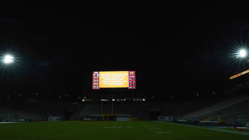 The Arizona State University football stadium displays a weather delay sign during a stop of a college football game between Arizona State and Southern Utah on Thursday, Aug. 31, 2023, in Tempe, Ariz.