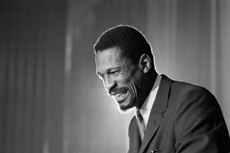 FILE - Bill Russell grins at announcement that he had been named coach of the Boston Celtics basketball team, April 18, 1966. The NBA great Bill Russell has died at age 88. His family said on social media that Russell died on Sunday, July 31, 2022. Russell anchored a Boston Celtics dynasty that won 11 titles in 13 years. (AP Photo, File)