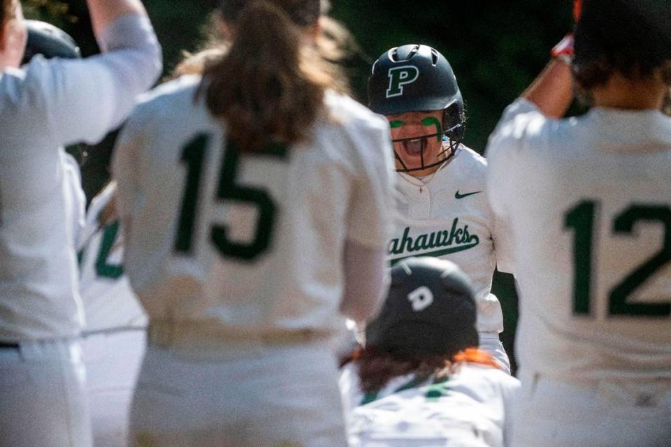 Peninsula’s Alli Kimball celebrates after hitting a home run in the bottom of the first inning of a 3A South Sound Conference game against Gig Harbor on Monday, April 17, 2023, at Peninsula High School in Gig Harbor, Wash.