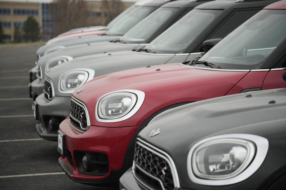 File - Used Mini vehicles are displayed at a dealership Friday, April 14, 2023, in Highlands Ranch, Colo. Over the past 12 months, gas prices have dropped, grocery costs have risen more slowly and used cars have become less expensive.(AP Photo/David Zalubowski, File)