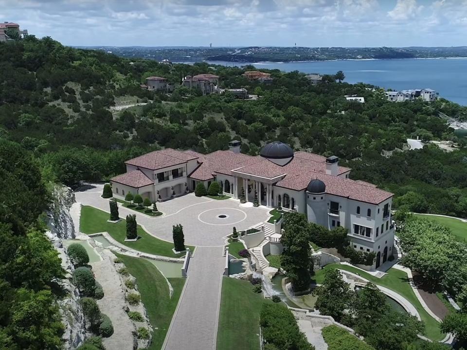 a home on a hill near the water in Texas