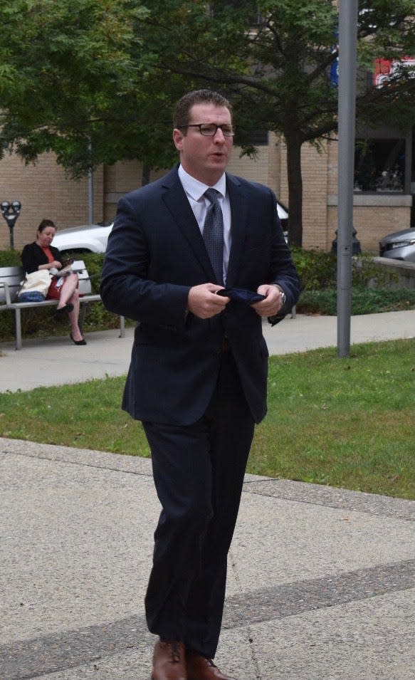 New Bedford City Councilor Hugh Dunn stands outside the Fall River Justice Center in this file photo.