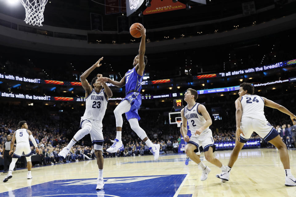 Creighton's Ty-Shon Alexander (5) goes up for a shot against Villanova's Jermaine Samuels (23) during the second half of an NCAA college basketball game, Saturday, Feb. 1, 2020, in Philadelphia. (AP Photo/Matt Slocum)