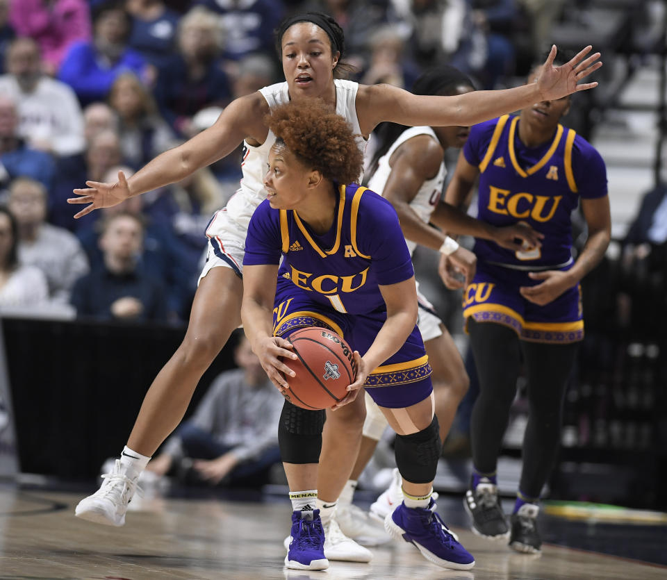 East Carolina's Alex Frazier is guarded by Connecticut's Napheesa Collier during the first half of an NCAA college basketball game in the American Athletic Conference tournament quarterfinals, Saturday, March 9, 2019, at Mohegan Sun Arena in Uncasville, Conn. (AP Photo/Jessica Hill)