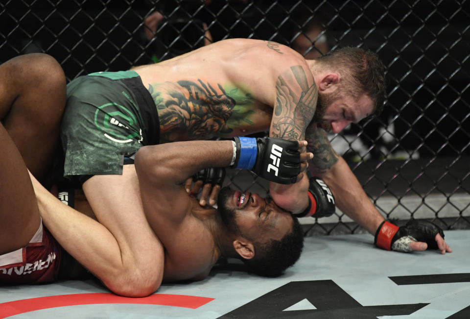 ABU DHABI, UNITED ARAB EMIRATES - JANUARY 20: (L-R) Michael Chiesa elbows Neil Magny in a welterweight fight during the UFC Fight Night event at Etihad Arena on UFC Fight Island on January 20, 2021 in Abu Dhabi, United Arab Emirates. (Photo by Jeff Bottari/Zuffa LLC)
