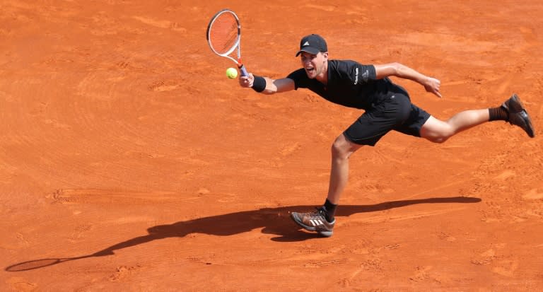 Dominic Thiem came from a set down to stun Novak Djokovic and reach the last eight