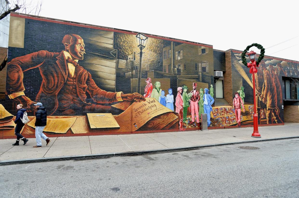 A mural dedicated to Du Bois and the Old Seventh Ward is painted on the corner of 6th and South streets in Philadelphia. <a href="https://www.gettyimages.com/detail/news-photo/general-view-of-the-mural-commemorating-the-seventh-ward-on-news-photo/502954290" rel="nofollow noopener" target="_blank" data-ylk="slk:Paul Marotta/Getty Images;elm:context_link;itc:0;sec:content-canvas" class="link ">Paul Marotta/Getty Images</a>