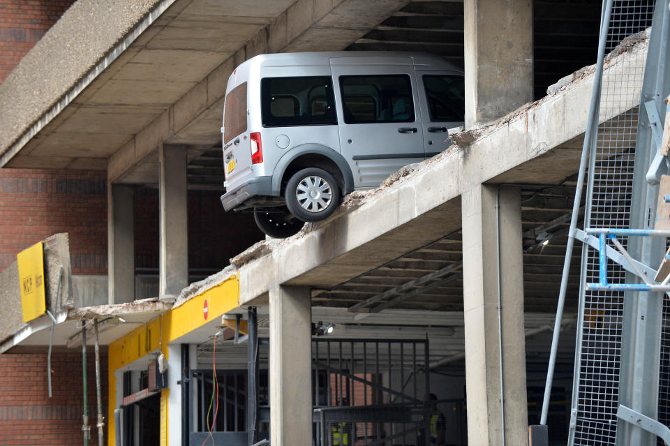 <em>Dangling – cars and vans were left hanging over a sheer drop after the collapse (Pictures: SWNS)</em>