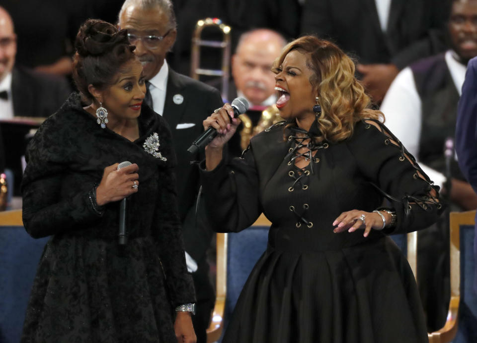 The Clark sisters, Dorinda Clark Cole, left, and Karen Clark Sheard perform during the funeral service for Aretha Franklin at Greater Grace Temple, Friday, Aug. 31, 2018, in Detroit. Franklin died Aug. 16, 2018 of pancreatic cancer at the age of 76. (AP Photo/Paul Sancya)