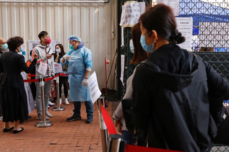 People queue up at a makeshift community testing centre for the coronavirus disease (COVID-19), in Hong Kong