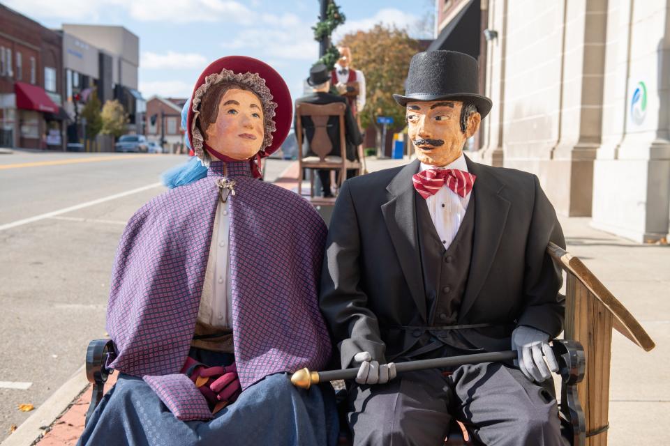 Victorian era characters fill downtown Cambridge during a Dickens Victorian Village holiday celebration.