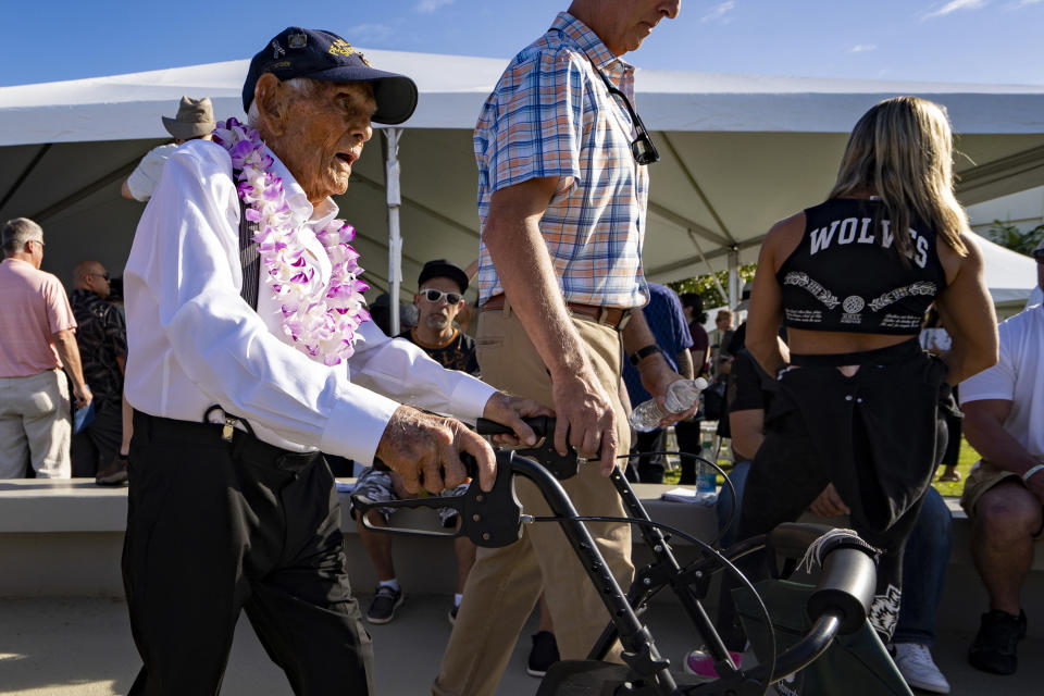 Pearl Harbor survivor Harry Chandler, 102, of Tequesta, Fla., leaves the 82nd Pearl Harbor Remembrance Day ceremony on Thursday, Dec. 7, 2023, at Pearl Harbor in Honolulu, Hawaii. Pearl Harbor Survivors, World War II veterans and their families gather in Pearl Harbor to commemorate those who perished 82 years ago. (AP Photo/Mengshin Lin)