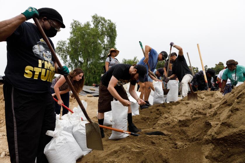 In preparation for the incoming storm from Hurricane Hilary, residents fill sandbags at the Bonita-Sunnyside Fire Protection District on Saturday, Aug. 19, 2023.