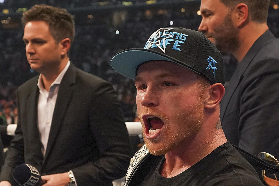 Canelo Alvarez celebrates after defeating Billy Joe Saunders in a unified super middleweight world championship boxing match, Saturday, May 8, 2021, in Arlington, Texas.(AP Photo/Jeffrey McWhorter)
