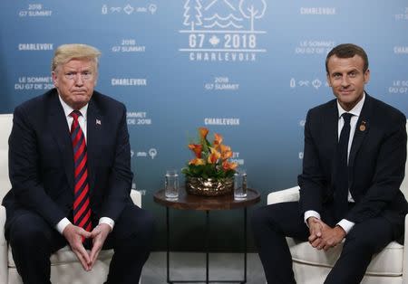 U.S. President Donald Trump sits side by side with France's President Emmanuel Macron during a bilateral meeting at the G7 Summit in Charlevoix, Quebec, Canada, June 8, 2018. REUTERS/Leah Millis