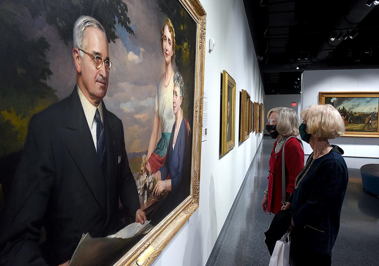 Frankye Mehrle, left, and Karen Ravenhill, both of Columbia, look at a painting by Greta Kempton of President Harry Truman, his daughter, Margaret, and his wife, Bess, on Tuesday at the State Historical Society of Missouri Center for Missouri Studies Art Gallery. The State Historical Society of Missouri celebrated 200 years of Missouri music, culture and art with a concert by the Columbia Chamber Choir, a curated tour of art objects, and various imagery of artwork and objects of Missouri’s statehood, including the Missouri Bicentennial Quilt.