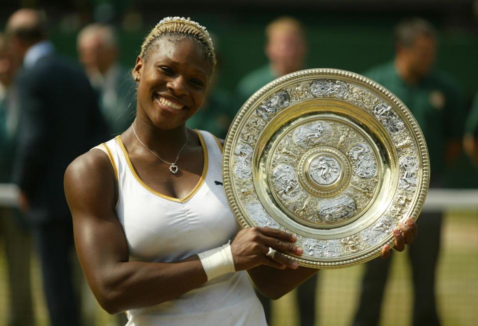 Serena Williams celebrates with the trophy after beating her sister Venus. (Photo by Mike Egerton/EMPICS via Getty Images)