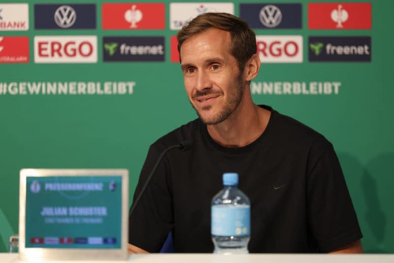 Freiburg coach Julian Schuster speaks during a press conference before the DFB Cup first round match between VfL Osnabrück and SC Freiburg at the Bremer Brücke stadium. Friso Gentsch/dpa