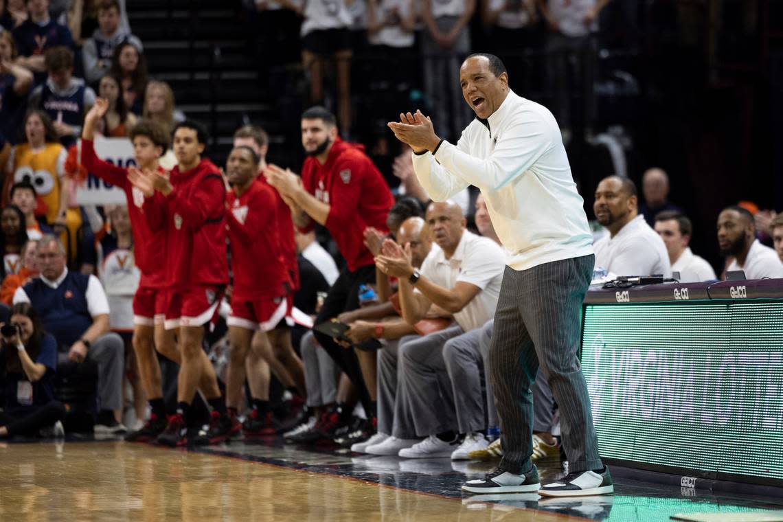 North Carolina State coach Kevin Keatts applauds during the first half of the team’s NCAA college basketball game against Virginia in Charlottesville, Va., Tuesday, Feb. 7, 2023. (AP Photo/Mike Kropf)