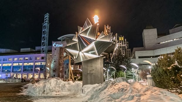 Ottawa's city government is lighting the flame on its Canada 150 cauldron every night as a tribute to its front-line workers. (Brian Morris/CBC - image credit)