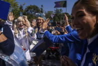 Visitors arrive the World of Frozen themed area during its opening ceremony at Disneyland Resort in Hong Kong, Monday, Nov. 20, 2023. (AP Photo/Louise Delmotte)